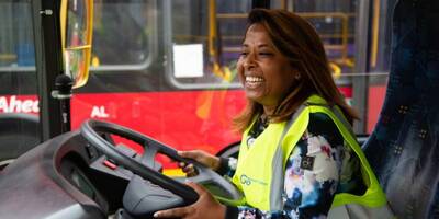 A female apprentice drives a bus as part of the Women with Drive scheme 